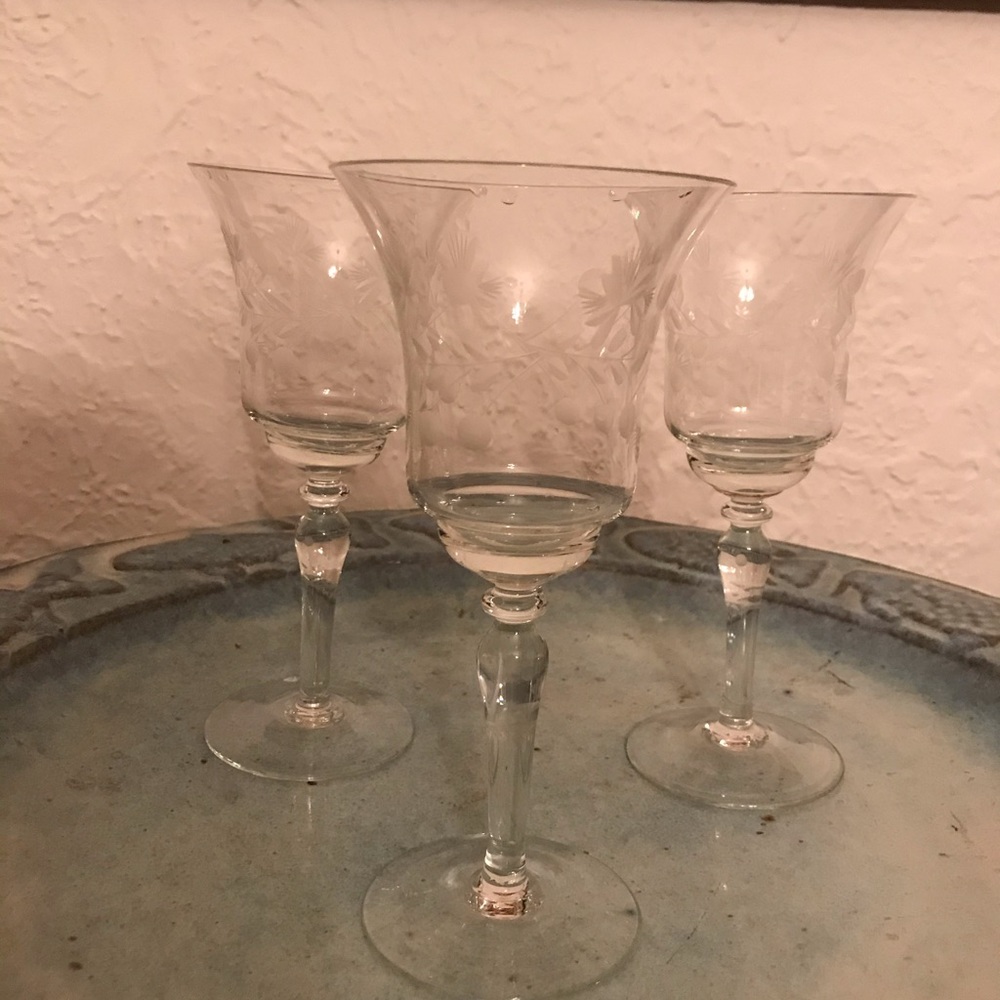 Three elegant vintage long stemmed wine glasses
